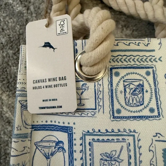 The item is a canvas wine bag by Tommy Bahama, designed to hold four bottles. - Picture 2 of 5